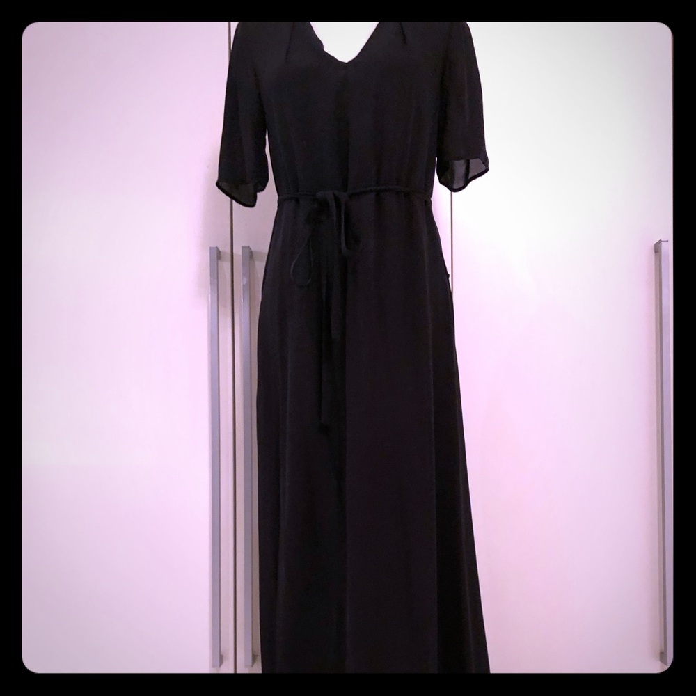 Black floor length dress with belt tie.